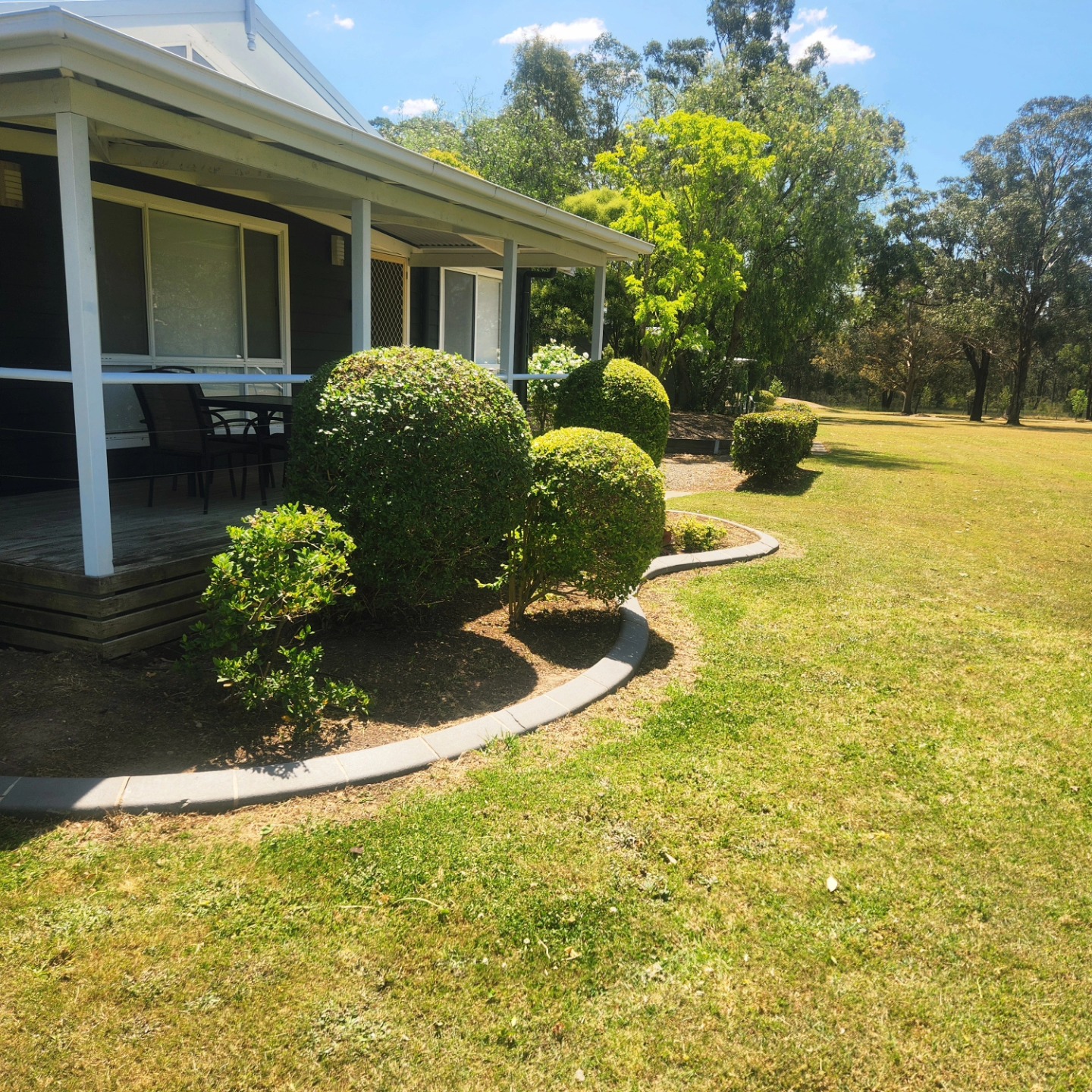 Topiary beside a Hills District farmhouse verandah